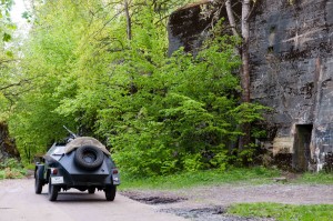 Replica-German-armoured-car-with-tourists-in-front-of-air-raid-bunker-at-Wolfs-Lair